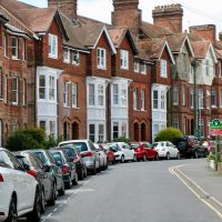 pexels-photo-2611873-2611873 Victorian-style houses and parked cars on a curved street in Royal Tunbridge Wells, UK.